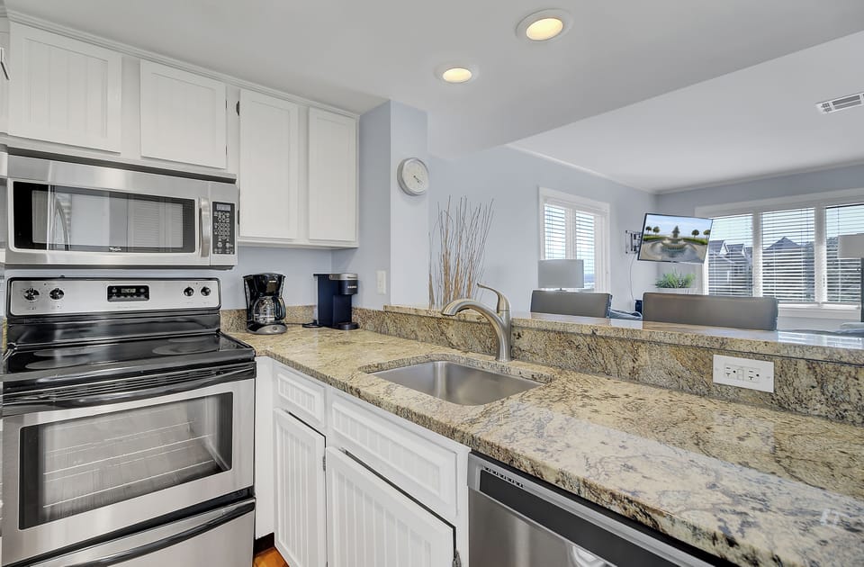 Granite countertops to compliment the fully equipped kitchen.