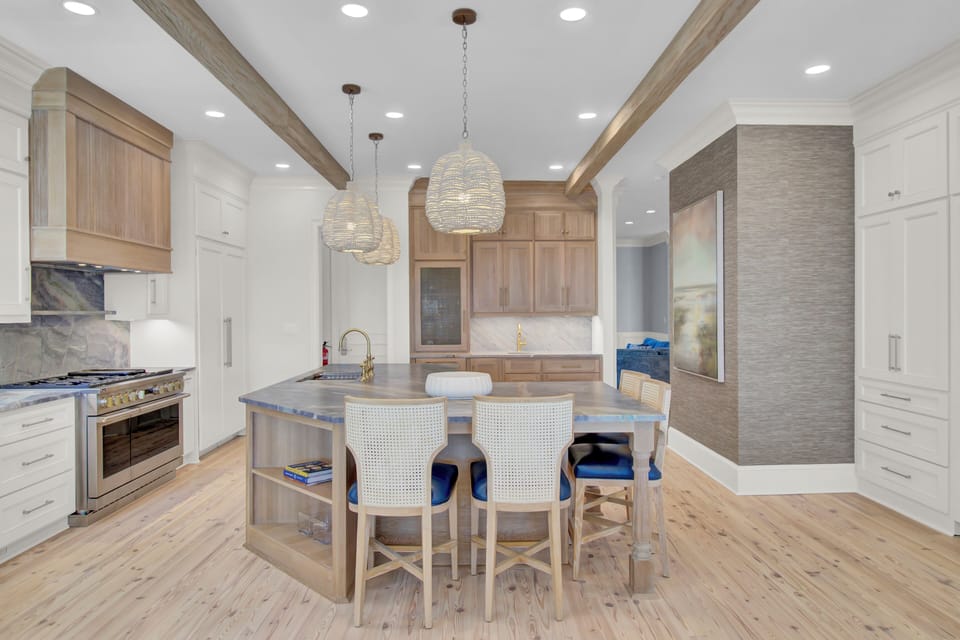 Spacious and fully equipped kitchen with modern stainless steel appliances.