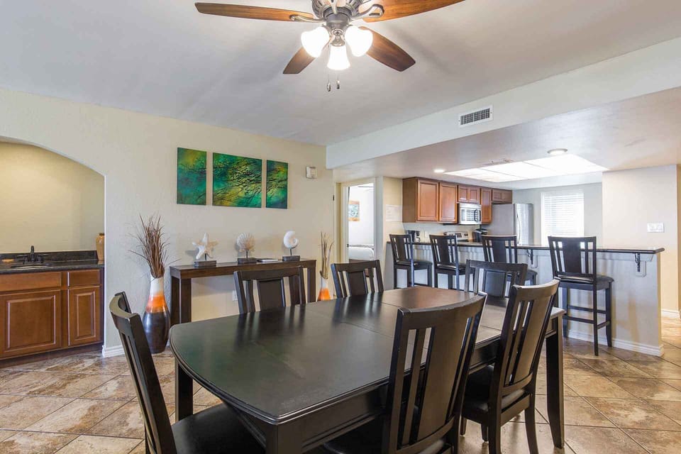 Room for six at the dining table with seating for more at the kitchen bar