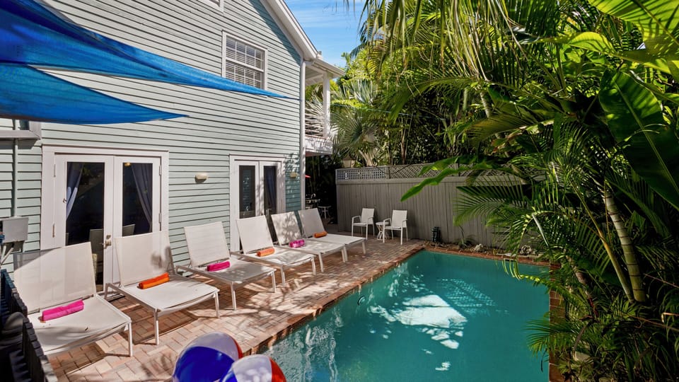 ENDLESS SUMMER is a 5 bedroom private home that was designed to accommodate a large group just half a block from Duval Street...