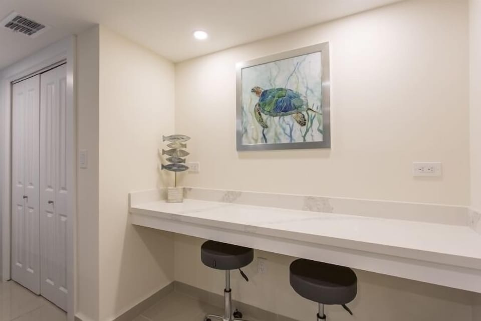 Our guest room includes this desk area that's perfect for working or writing. Why work from home when you can work from the beach?