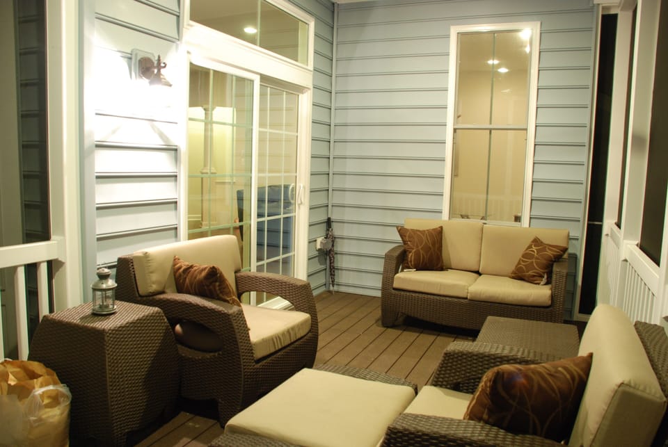 Outdoor living with enclosed porch.