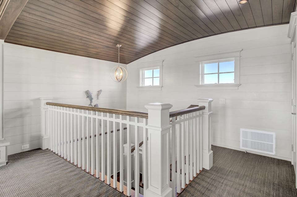 Top floor is an additional living area and game room.