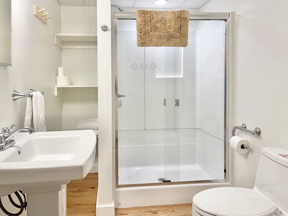 Bathroom 3 on the lower level has a walk-in shower and plenty of storage for your belongings