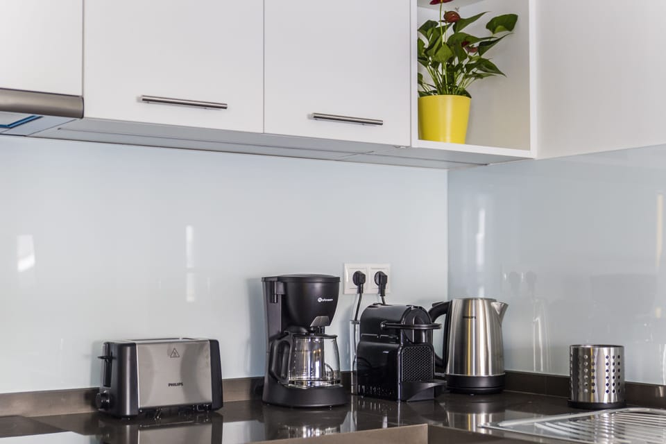 Deluxe Apartment, 4 Bedrooms, Balcony, City View | Coffee and/or coffee maker