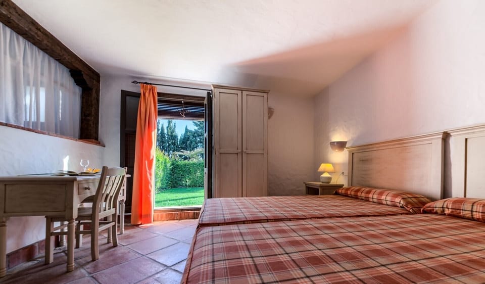 Beds and garden views from Lavanda and Romero apartments in Hacienda Roche Viejo in Conil