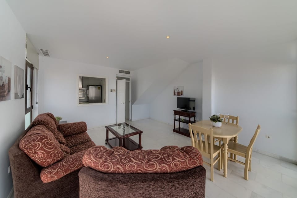 Sofas and table of Mercurio Apartment 1 living room in Villas Flamenco Rentals in Conil