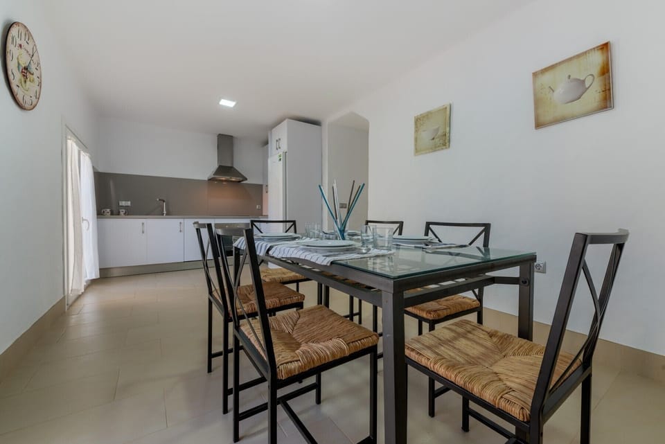 Table and chairs of Villa Cala Encendida Kitchen in Villas Flamenco Beach in Conil