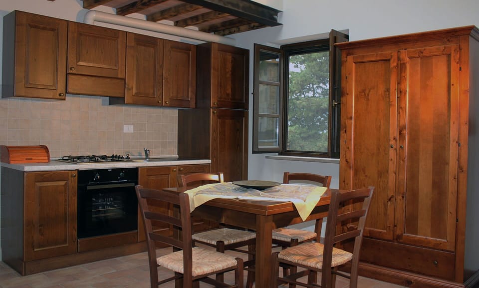Furniture, Countertop, Room, Cabinetry, Kitchen, Property, Building, Interior Design, Wood Stain, Floor