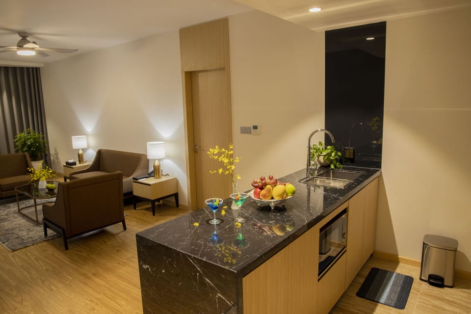 Deluxe Two-bedroom Apartment | Private kitchen | Fridge, electric kettle, paper towels
