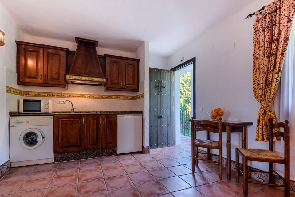Furniture of the kitchen of the apartments in upper floor in Hacienda Roche Viejo in Conil