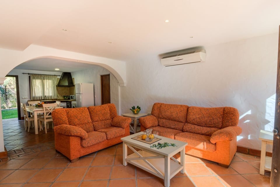 Sofá and table of Hierbabuena apartment in Hacienda Roche Viejo in Conil