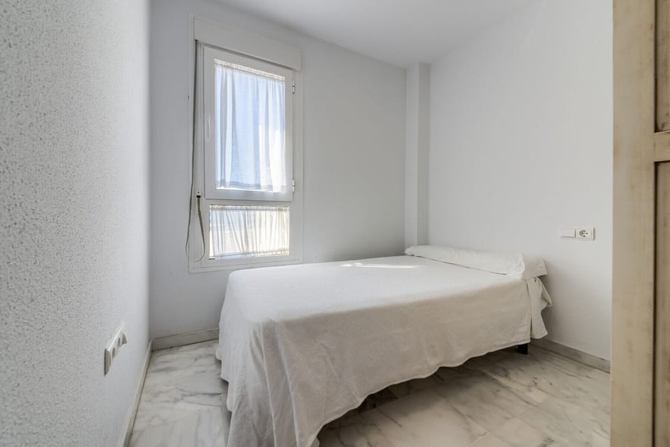 The beds of the bedroom of Bécquer apartment in Villas Flamenco Rentals in Conil