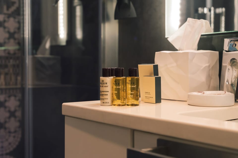 Deluxe Double Room, Balcony, City View | Bathroom | Rainfall showerhead, designer toiletries, hair dryer, slippers