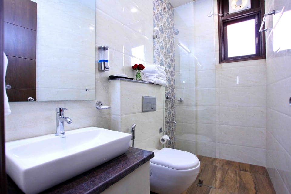 Shower, rainfall showerhead, designer toiletries, hair dryer