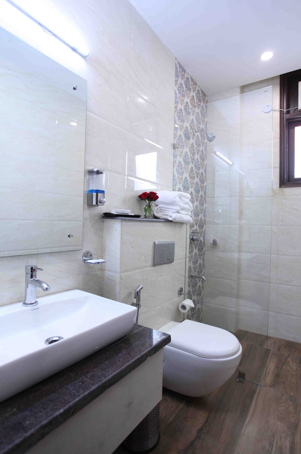 Shower, rainfall showerhead, designer toiletries, hair dryer