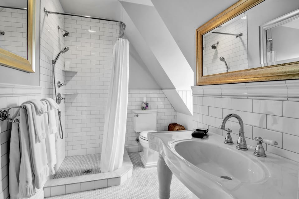 Frederick Law Olmsted | Bathroom | Designer toiletries, hair dryer, bathrobes, slippers