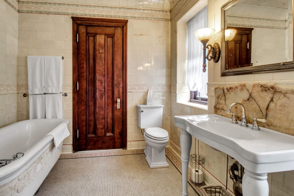 Hewitt Suite | Bathroom | Designer toiletries, hair dryer, bathrobes, slippers