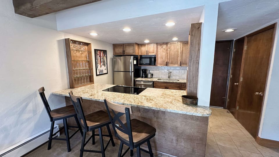 Kitchen with barstools.