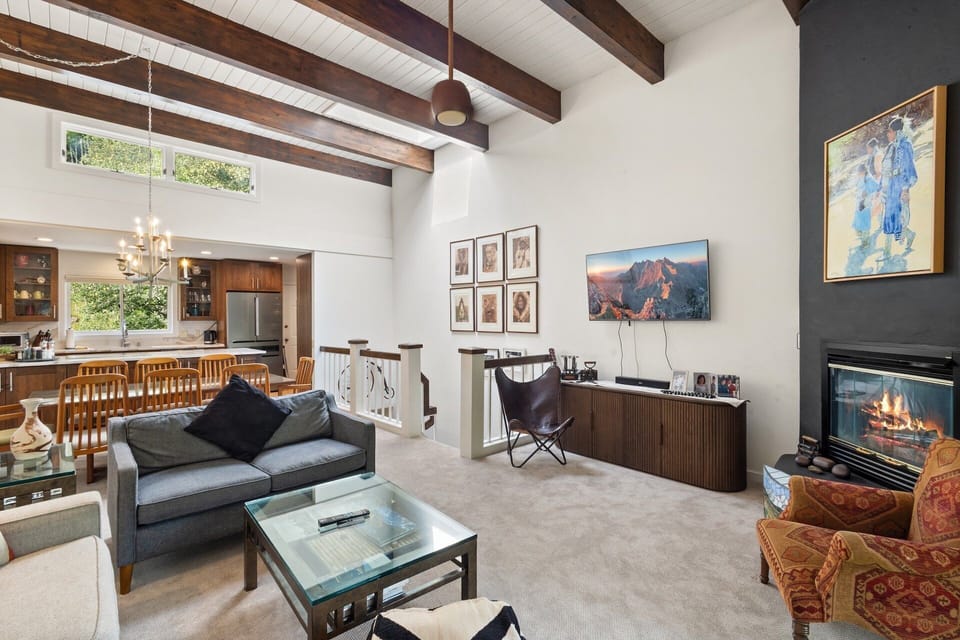 Take the stairs to the second floor and the living and  balcony area along with kitchen and dining.
