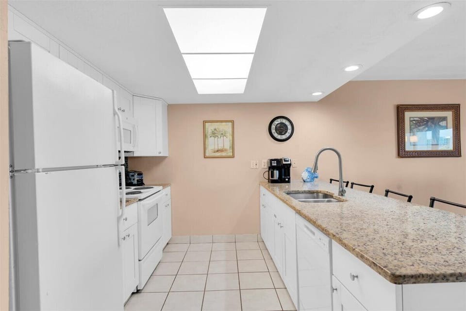 Your fully equipped kitchen features granite countertops, modern appliances, and plenty of space to prepare delicious home-cooked meals during your stay.
