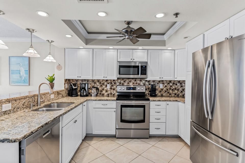 Your fully equipped kitchen features granite countertops, stainless steel appliances, and everything you need to create memorable meals during your stay.