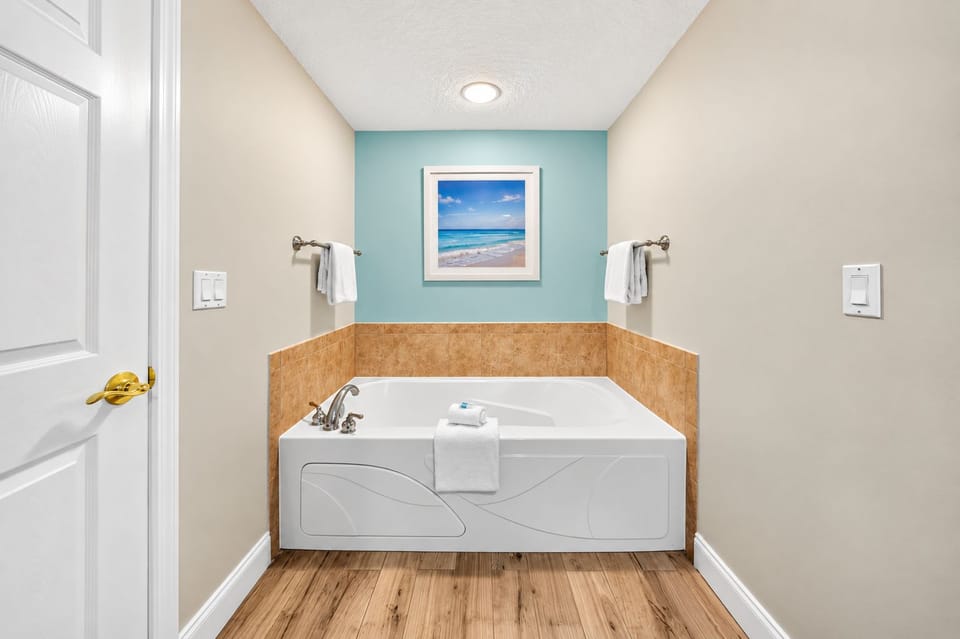 Slip into your private soaking tub and let the warm water melt away the day. Fresh towels and calming coastal tones surround you for the perfect at-home spa escape.