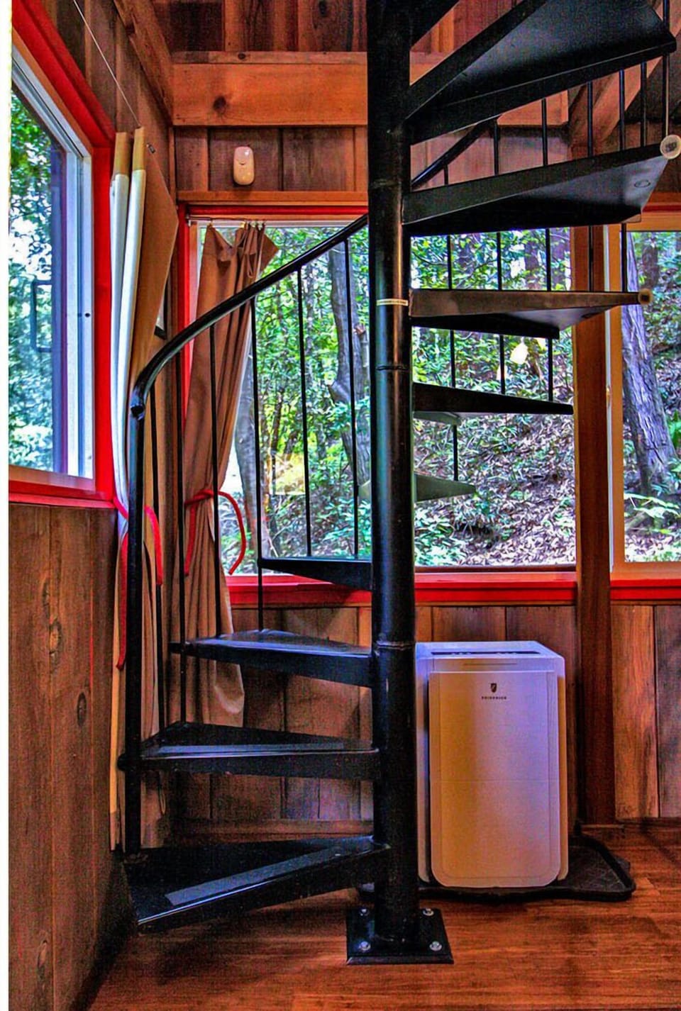 A spiral staircase connects the upper and lower levels without having to go outside.