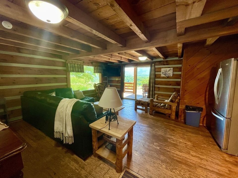 Main level open floor plan view from Kitchen looking to living area and dining table to the left.