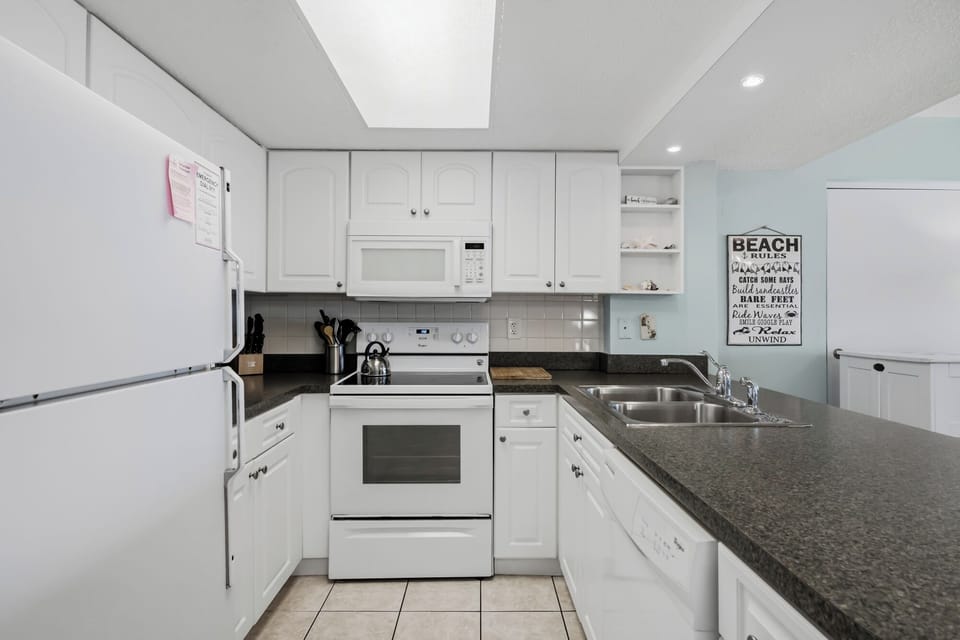 Cook your favorite meals in this fully equipped kitchen, complete with modern appliances, ample counter space, and everything you need for a relaxing stay.
