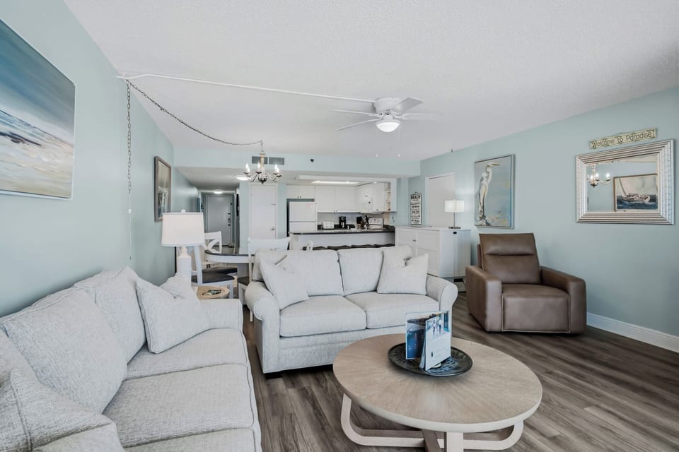 Relax in your electric leather recliner and unwind in your calming, open-plan retreat, where gentle coastal colors and ample space invite you to truly relax and make yourself at home.