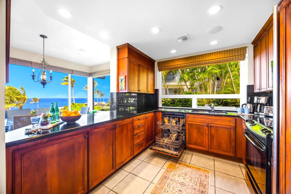 The guest bathroom features an updated glass walk in shower and separate soaking tub for ultimate relaxation