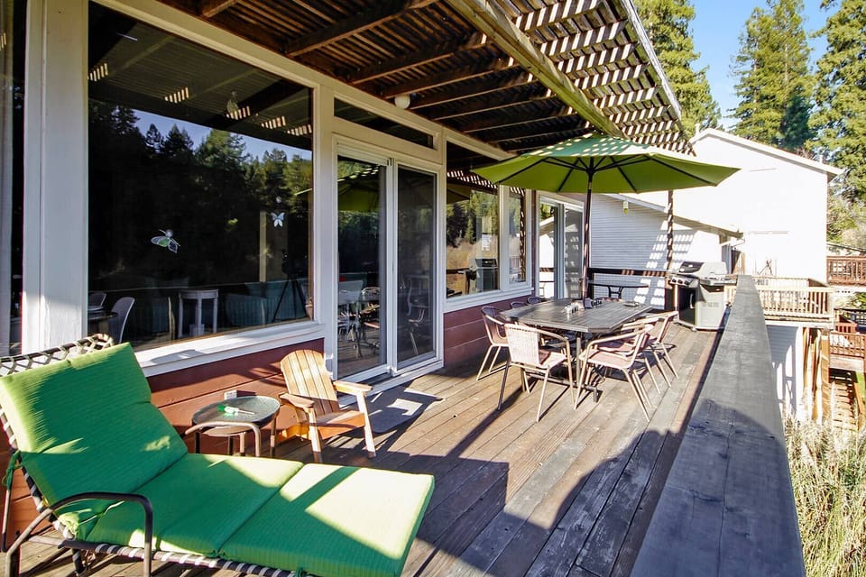 Riverfront deck spans the living and dining rooms and kitchen!