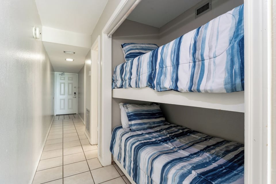 Our vacation home has enough room for 2 in the primary bedroom and 2 more in the hallway alcove. 