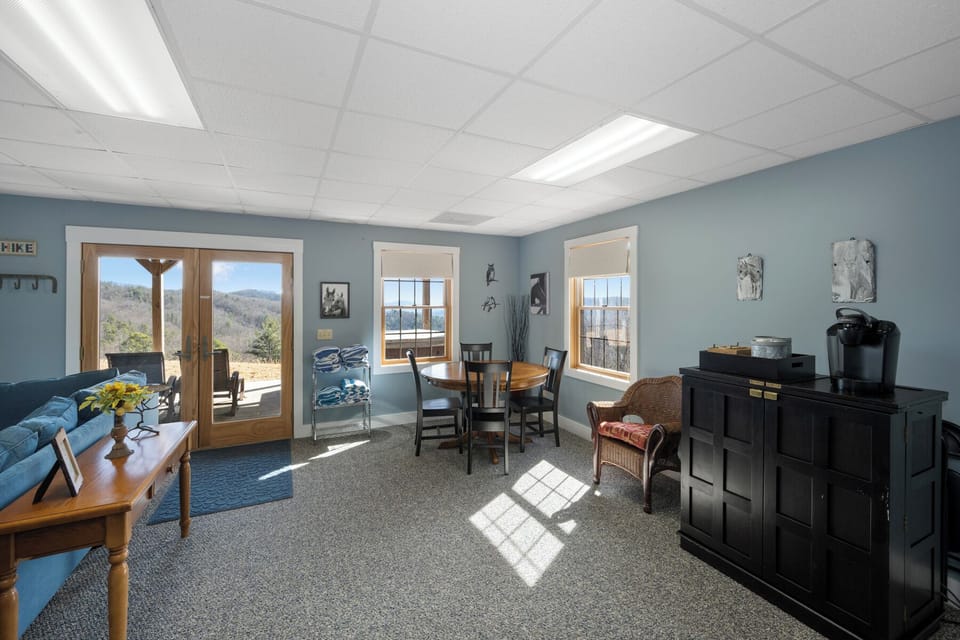 Your bright common area combines dining and relaxation with stunning mountain views streaming through oversized windows.
