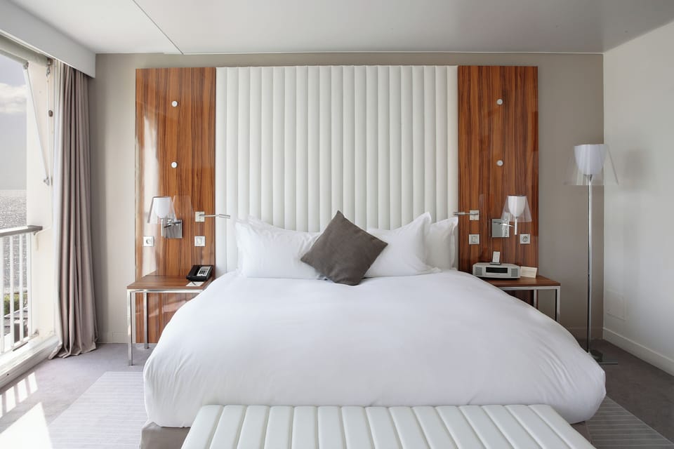 Premium bedding, down comforters, minibar, in-room safe