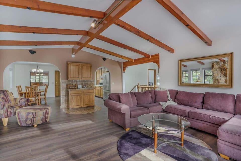 Living Room with L-shaped couch, Flat Screen TV and Wet Bar