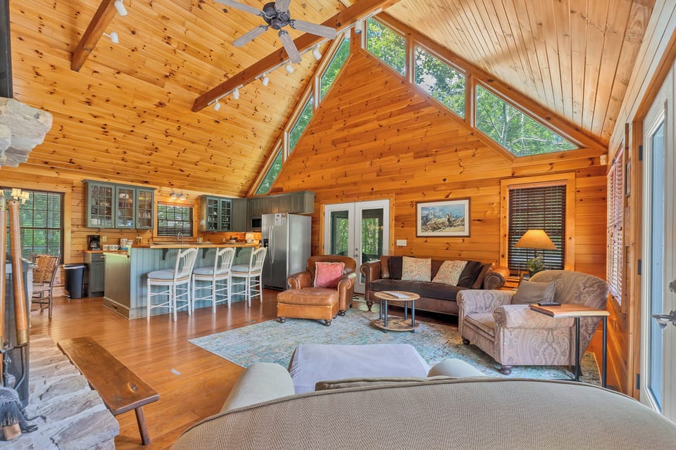 Large spacious living room with plenty of seating for movies.