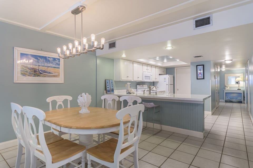 There are 4 seats around our table and 1 stool at the breakfast bar.