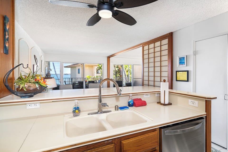 Kitchen overlooking living space and equipped with Dishwasher