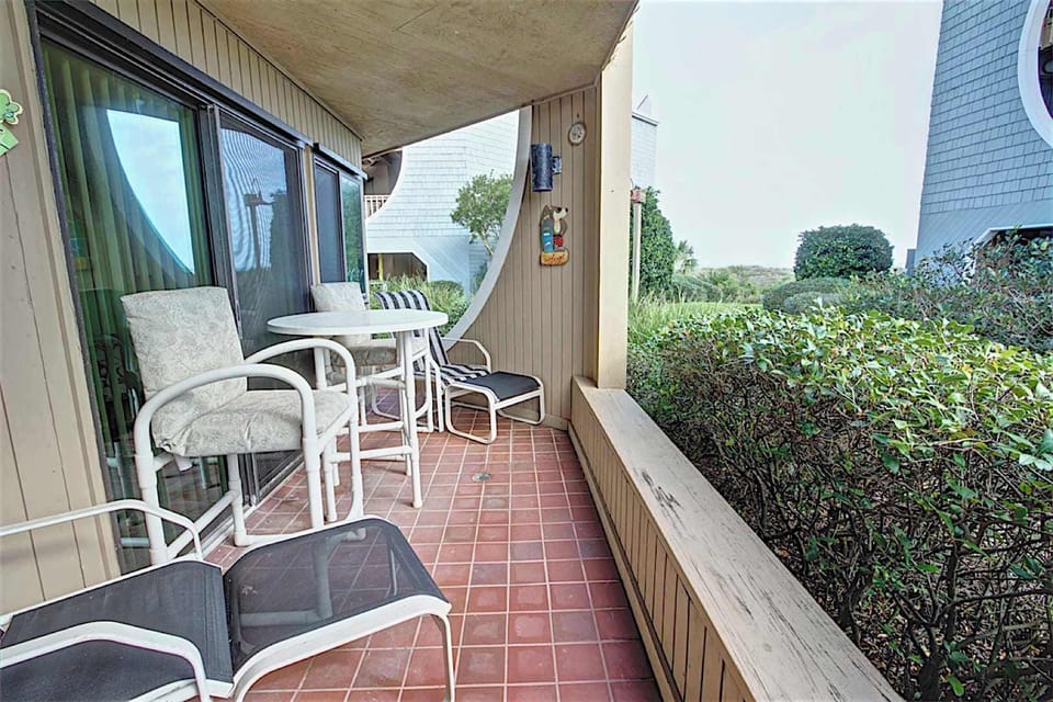 - Unwind on your private patio with two lounge chairs and a high top bistro set
- Surrounded by beautiful greenery and privacy hedges just steps from the path
- Perfect spot for morning coffee or a laid back evening glass of wine