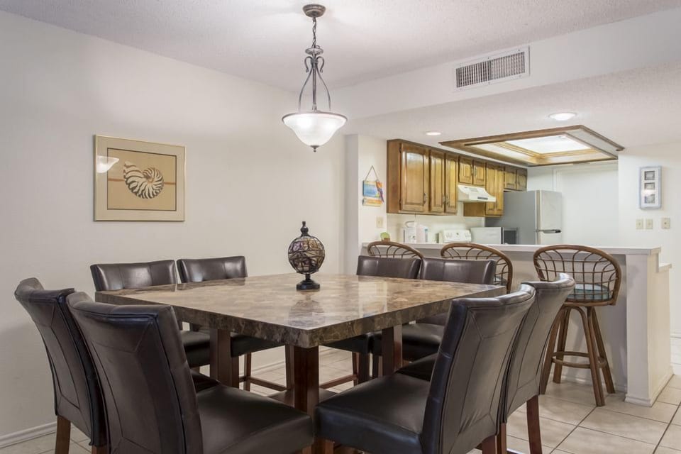 Our elegant dining space seats 8 around the table with 3 more at the kitchen bar. Whether you're looking to challenge the crew on game night or share a homecooked meal, our dining room has room for everyone.