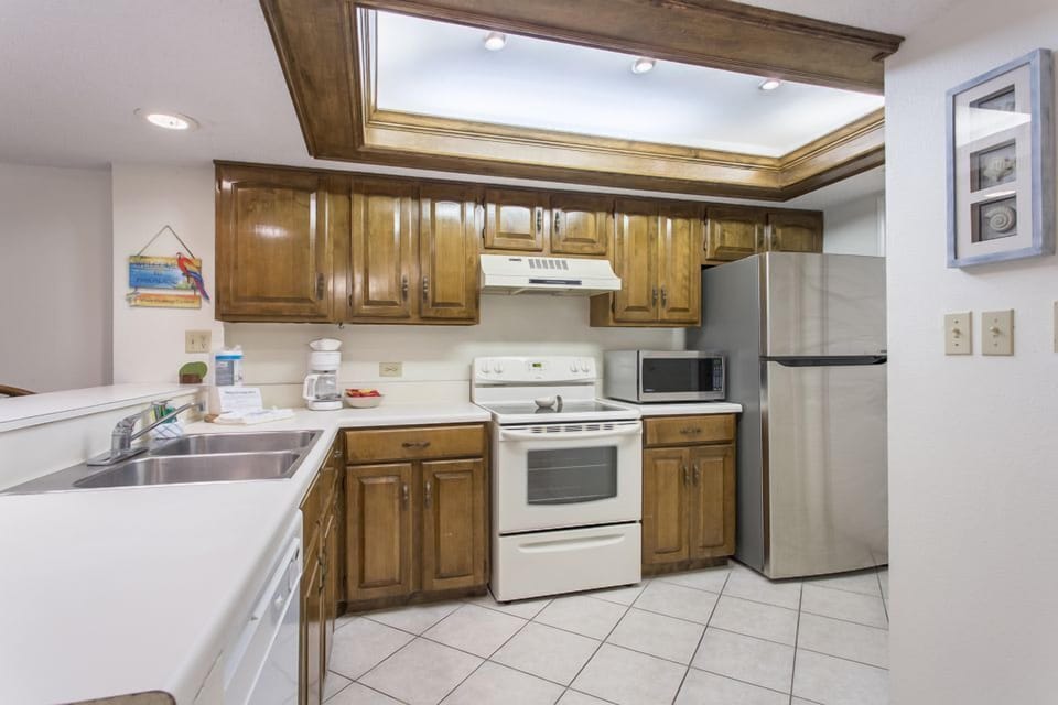 Our tiled kitchen has full-size appliances and plenty of counter space. Cooking will be just like at home.