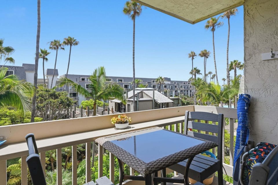 Feel the gentle ocean breeze from your private outdoor oasis, nestled above the resort's beautiful tropical grounds