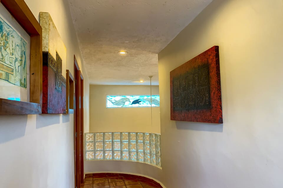 Surprises around every corner - Second floor hallway with three bedroom entrances.