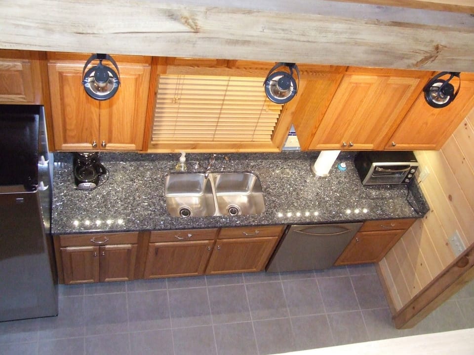 You can enjoy preparing your families favorite meal in this fully furnished kitchen with a bright open design with stainless steel appliances.