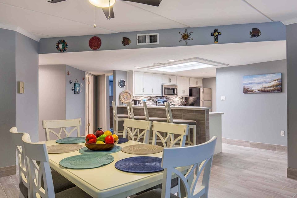 Seating for six at the dining table with more at the kitchen bar.
