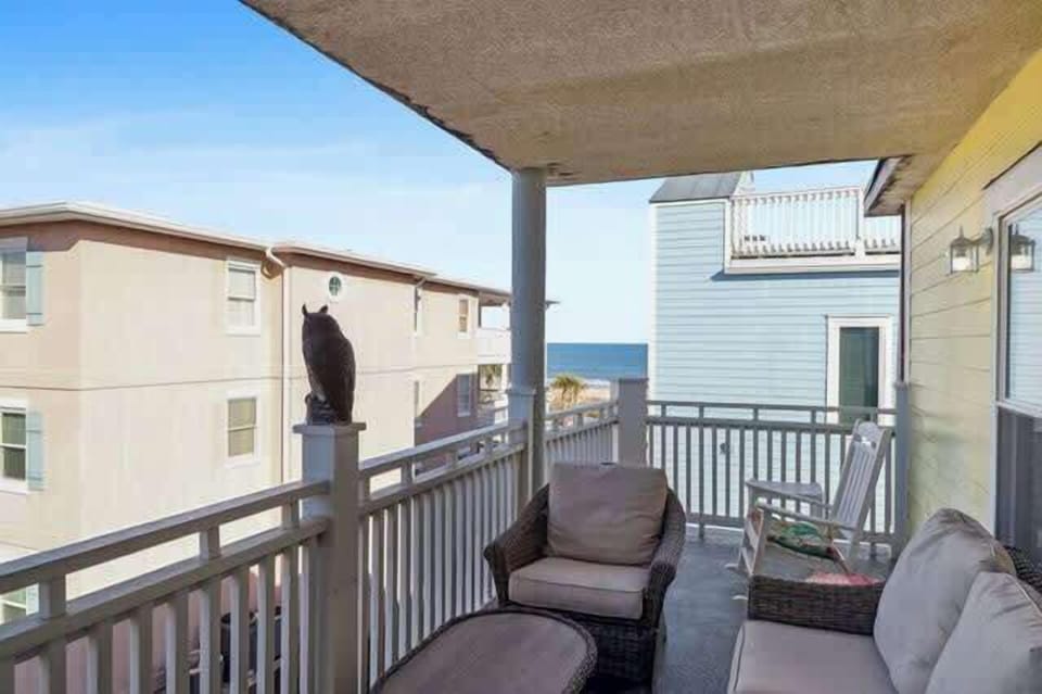 3rd floor balcony seating & ocean views! One building back from beach.
