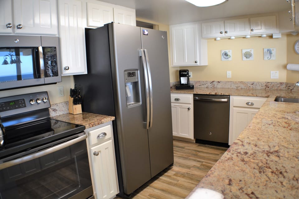 Updated kitchen with granite counters and new appliances.