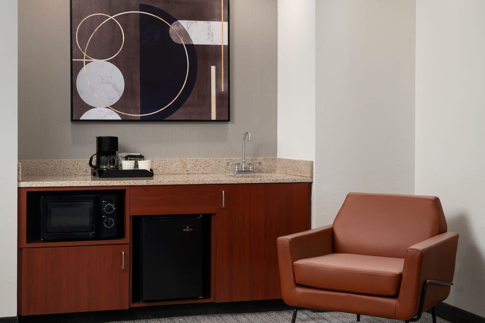 Suite, 1 Bedroom | Living area | 32-inch LCD TV with cable channels, TV